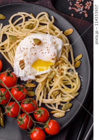 Delicious hearty breakfast consisting of poached eggs on toast with cream cheese, asparagus 114553937