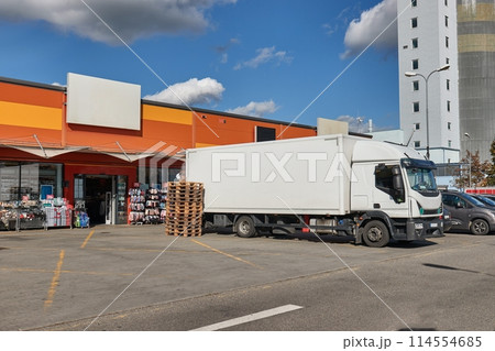 Truck delivering goods to shops Truck delivering goods to shops 114554685