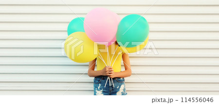 Summer, holiday, celebration, happy cheerful woman with bright colorful balloons on white background Summer, holiday, celebration, happy cheerful woman with bright colorful balloons on white background 114556046