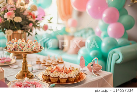 Birthday table decoration with sweets, flowers, candles and pink balloons. Selective focus 114557334