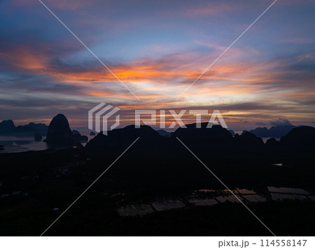 Aerial view sunset sky,Nature beautiful Light Sunset or sunrise over sea,Colorful dramatic majestic scenery sunset Sky with Amazing clouds and waves in sunset sky nature light cloud background 114558147