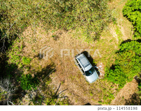Top view Brown American SUV Jeep Grand Cherokee WJ 2002 on the dirt road in Phuket Thailand,Off-road in the forests Top view Brown American SUV Jeep Grand Cherokee WJ 2002 on the dirt road in Phuket Thailand,Off-road in the forests 114558198
