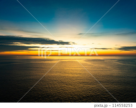 Aerial view sunset sky, Beautiful Light Sunset or sunrise over sea,Colorful dramatic majestic scenery sunset Sky, Amazing clouds and small waves in the ocean, Wonderful light cloud background Aerial view sunset sky, Beautiful Light Sunset or sunrise over sea,Colorful dramatic majestic scenery sunset Sky, Amazing clouds and small waves in the ocean, Wonderful light cloud background 114558253