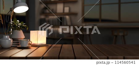 A copy space for displaying products on a wooden tabletop in a dark minimalist room at night. A copy space for displaying products on a wooden tabletop in a dark minimalist room at night. 114560541