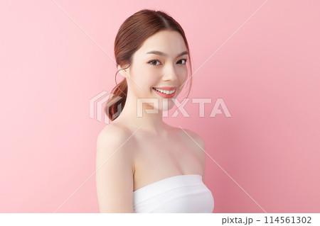 Beautiful young asian woman with clean fresh skin on pink background, Face care, Facial treatment, Cosmetology, beauty and spa, Asian women portrait. 114561302