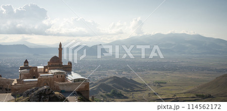 Historical Arabian palace with minarets overlooking city in the valley beneath, Eastern Turkey Historical Arabian palace with minarets overlooking city in the valley beneath, Eastern Turkey 114562172