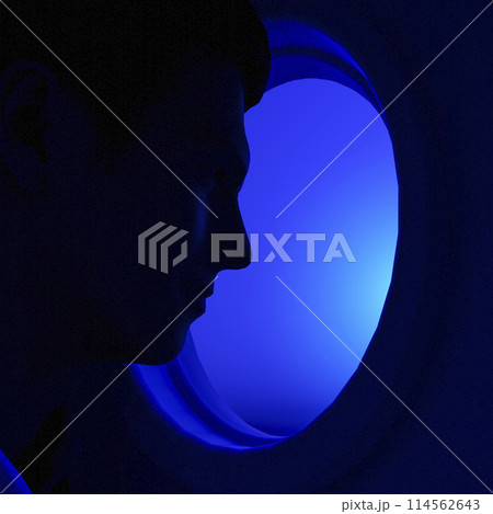 A man looks out the porthole 114562643