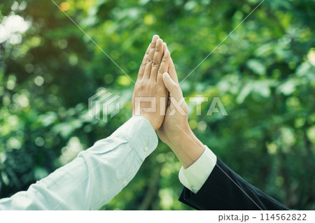 Group of volunteer people joining for cooperation about global community teamwork with join hand together, World environment day, sustainable development goal. 114562822