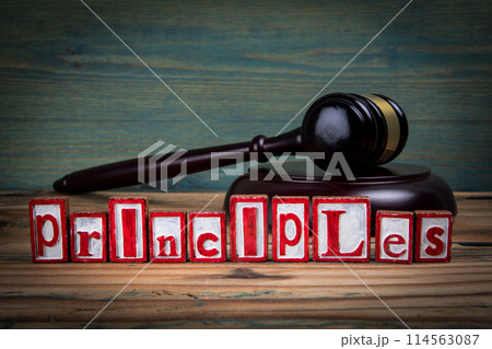 PRINCIPLES. Red alphabet letters and judge's gavel on wooden background. Laws and justice concept PRINCIPLES. Red alphabet letters and judge's gavel on wooden background. Laws and justice concept 114563087