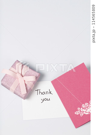 Handmade greeting card. Near gift in wrapping paper, tied with a ribbon. Original gift. 114565809