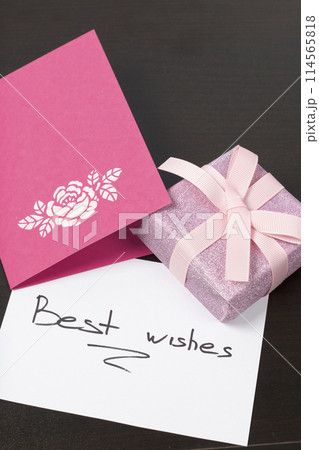 Handmade greeting cards. Near gift in wrapping paper, tied with a ribbon. Original gift. 114565818