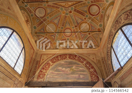 The ceiling of a church is decorated with a variety of designs and patterns 114566542