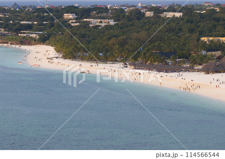 Zanzibar beach with a lot of people and background luxury resort Zanzibar beach with a lot of people and background luxury resort 114566544