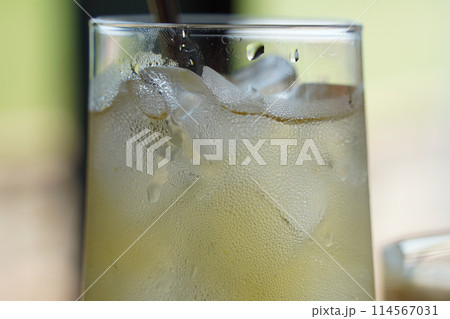 Refreshing lemonade in a glass on a table in a cafe 114567031