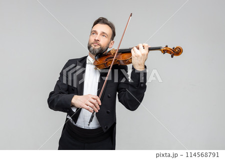 Man classic violinist at musical elegant performance 114568791