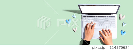 Laptop computer with heart cushions 114570624