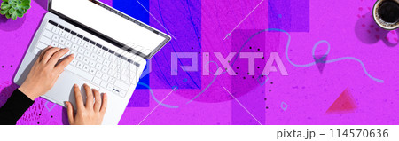 Person using a laptop computer Person using a laptop computer 114570636