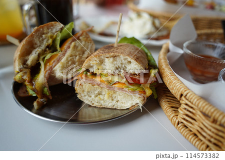 Sandwich with ham, cheese, lettuce, tomato and mayonnaise Sandwich with ham, cheese, lettuce, tomato and mayonnaise 114573382