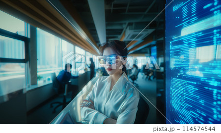 Selective focus of Asian business woman using AR glasses in the office. Selective focus of Asian business woman using AR glasses in the office. 114574544