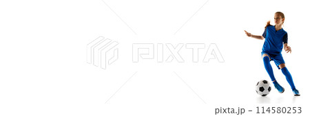 Teenager, female soccer player in blue uniform in motion with ball, practicing isolated on white studio background Teenager, female soccer player in blue uniform in motion with ball, practicing isolated on white studio background 114580253