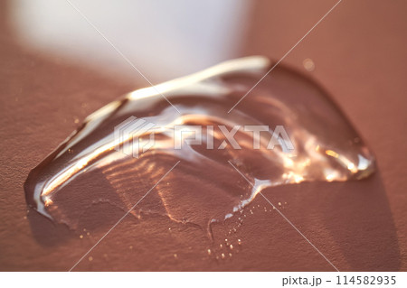 Beautiful volumetric drop of cosmetic product on a pink background. Beautiful volumetric drop of cosmetic product on a pink background. 114582935