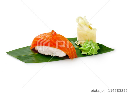 Salmon nigiri sushi with roe, ginger and wasabi on bamboo leaf Salmon nigiri sushi with roe, ginger and wasabi on bamboo leaf 114583833
