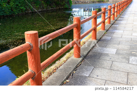 Concrete fence made to look like wood along the Canalside walkway. 114584217