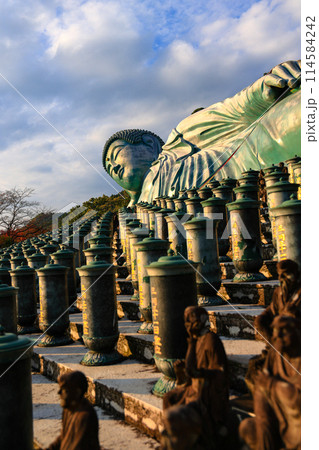The largest reclining bronze Buddha statue in the world at nanzo-in Temple, Fukuoka Prefecture, Japan. The largest reclining bronze Buddha statue in the world at nanzo-in Temple, Fukuoka Prefecture, Japan. 114584242