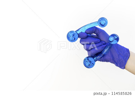 Mockup Human Gloved Hand Holds Blue Acrylic Back, Leg, Neck Massage Tool. Deep Tissue Massage, Thumb Massager with Knobs for Gentle Point, Muscles Relaxation. Design, Copy Space.Horizontal Mockup Human Gloved Hand Holds Blue Acrylic Back, Leg, Neck Massage Tool. Deep Tissue Massage, Thumb Massager with Knobs for Gentle Point, Muscles Relaxation. Design, Copy Space.Horizontal 114585826