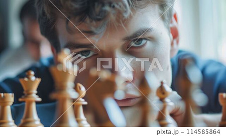 The chess player focus and planning on the next move of the board game. AIG43. The chess player focus and planning on the next move of the board game. AIG43. 114585864