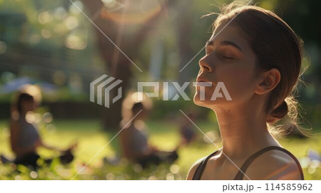 The person is meditating at the park with calm under bright light of sun. AIG43. The person is meditating at the park with calm under bright light of sun. AIG43. 114585962