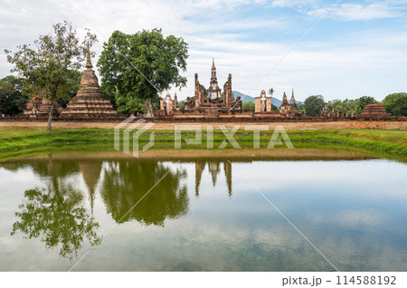Scenery view of Wat Mahathat temple the most important and impressive temple compound in Sukhothai Historical Park in Sukhothai province of Thailand. 114588192