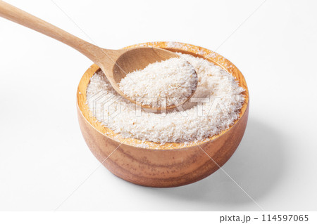 Psyllium husk in wood spoon with wooden bowl isolated on white background, closeup 114597065