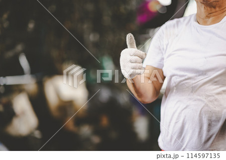 mechanic hand thumbs up for finish check service car in garage auto workshop good healthy engine with space for text 114597135