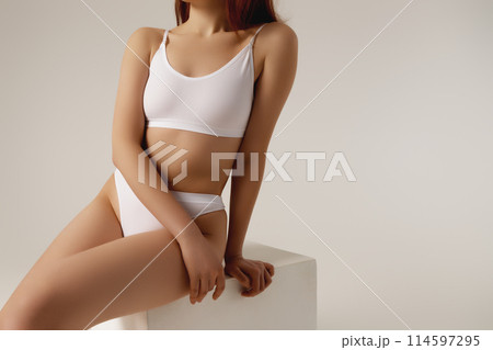 Cropped image of female body, breast in white 114597295