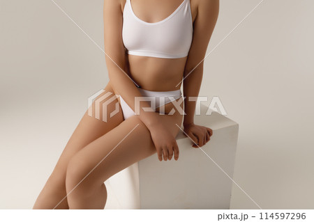 Cropped image of female body, breast in white Cropped image of female body, breast in white 114597296