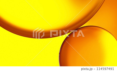 macro abstract photography of oil and water on golden yellow gradient background 114597491