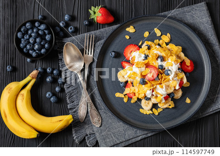 fresh berries, banana with corn flakes and yogurt fresh berries, banana with corn flakes and yogurt 114597749