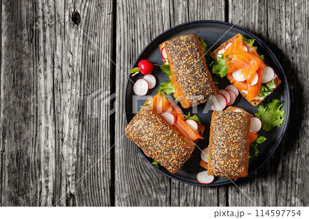 smoked salmon sandwiches on rye bread rolls 114597754
