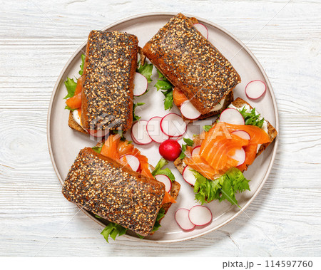 smoked salmon sandwiches on rye bread rolls smoked salmon sandwiches on rye bread rolls 114597760