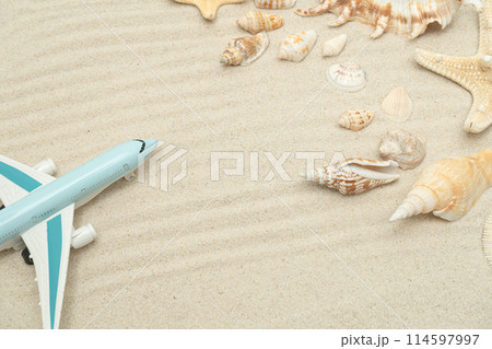 Summer travel concept. Tropical sand, shells and airplane. Background for summer vacation, travel, trip. Flat lay, copy space 114597997