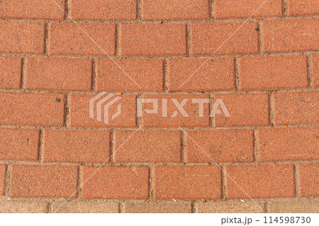 Red brick pavement texture with a regular, rectangular pattern. Red brick pavement texture with a regular, rectangular pattern. 114598730