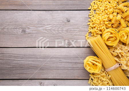 Delicious mixed pasta on a grey wooden background Delicious mixed pasta on a grey wooden background 114600743