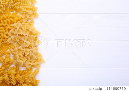 Delicious mixed pasta on a white wooden background Delicious mixed pasta on a white wooden background 114600750