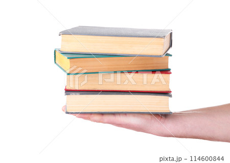 Hand holding old books on white background Hand holding old books on white background 114600844