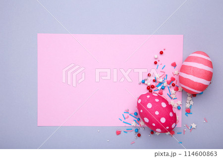 Colorful easter eggs with sprinkles on a grey background Colorful easter eggs with sprinkles on a grey background 114600863