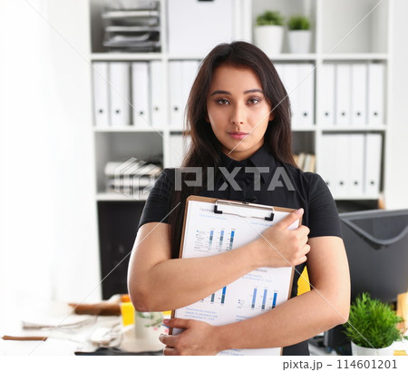 portrait of young beautiful brunette businesswoman work in office 114601201
