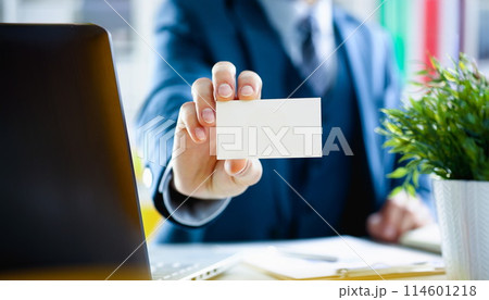 Male arm in suit give blank calling card 114601218