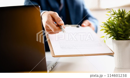 Male arm in suit offer contract form on clipboard Male arm in suit offer contract form on clipboard 114601238