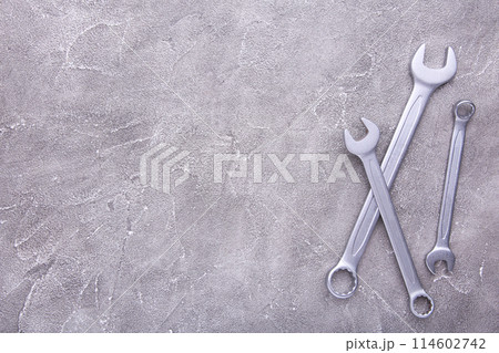 Combination wrenches for repair on grey background 114602742